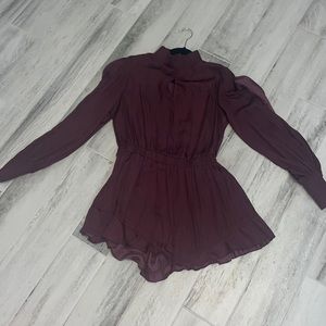 Burgundy romper. Slits on arms.